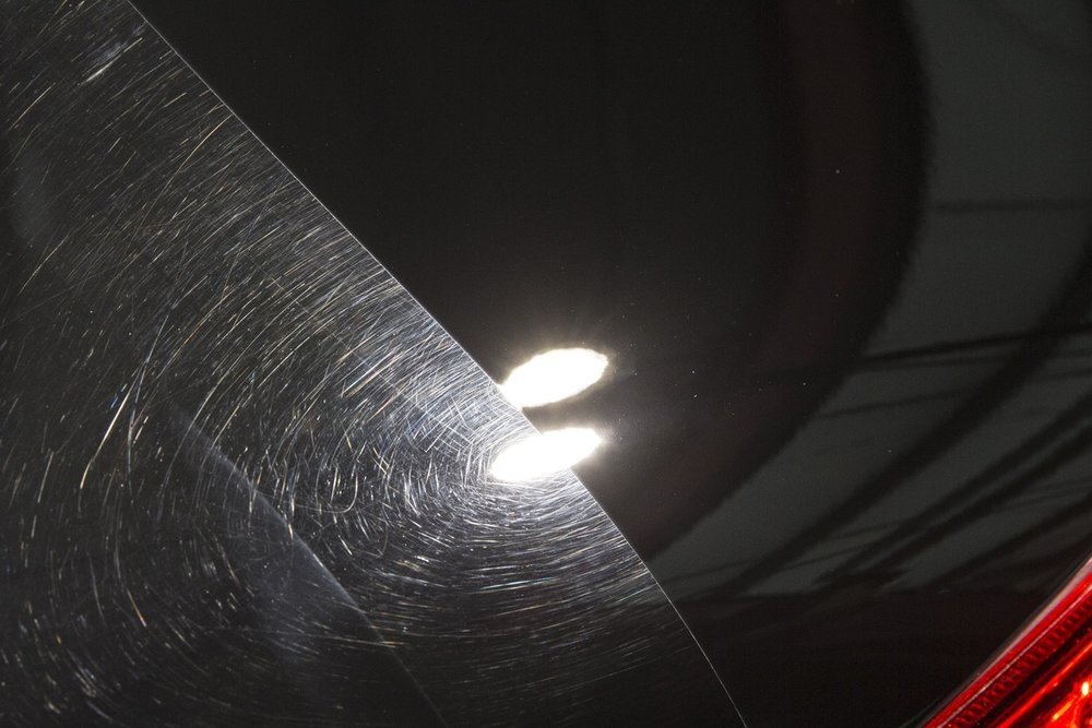 Paint correction before and after transformation showing restored vehicle finish